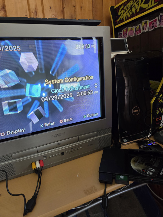 playstation 2 with system info on tv screen