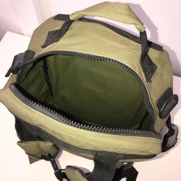 Top view of green backpack with zipper opened.